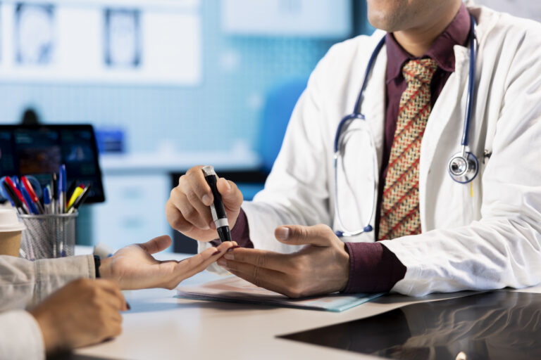 Medical consultation with physician using an insulin injector for a patient
